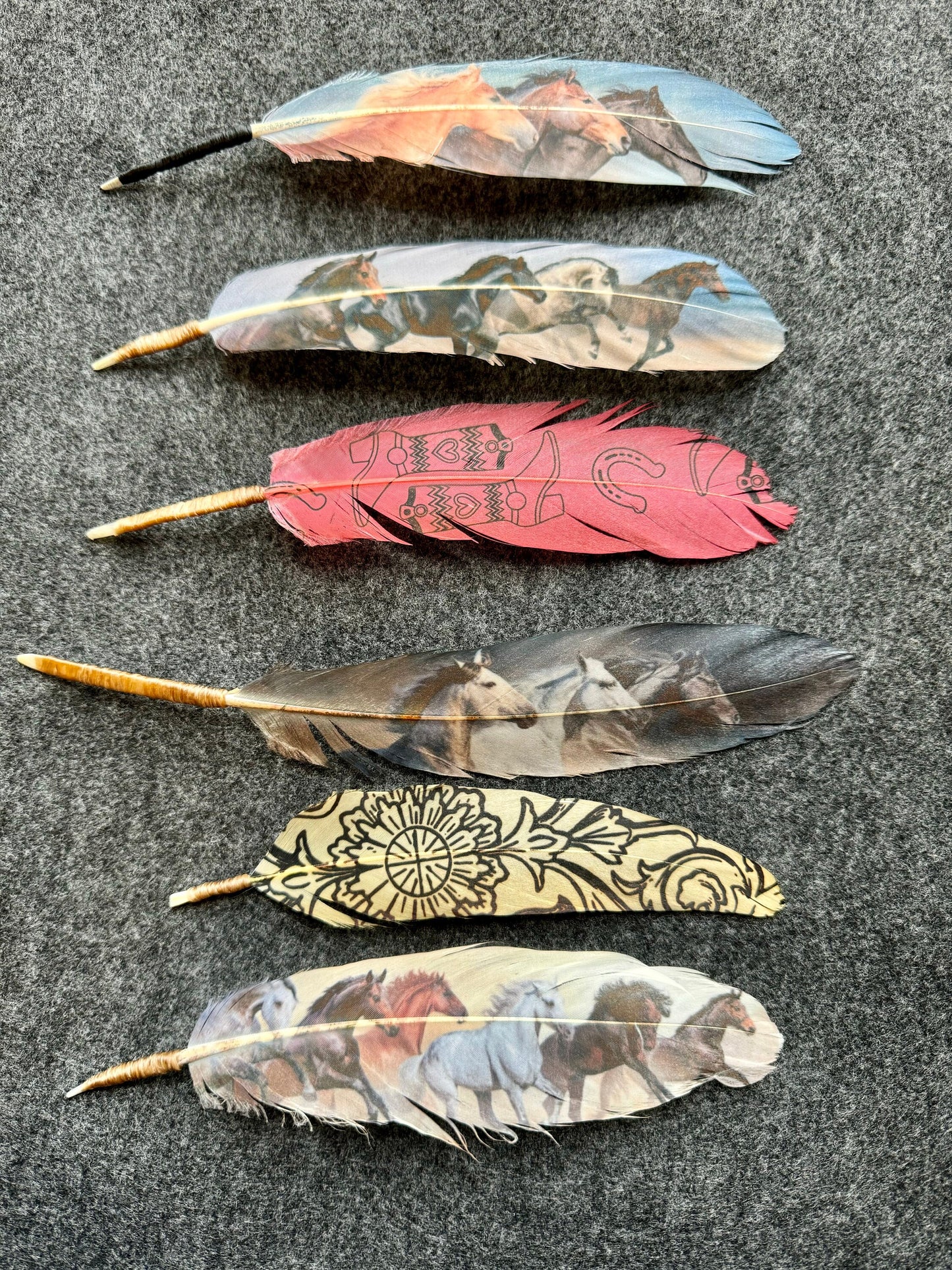 Decorative feathers with patterns on a dark surface