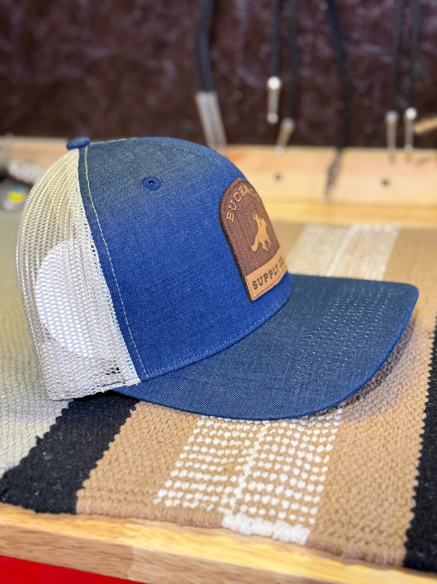 Buckaroo Supply Co. denim leather patch cap with Western cowboy logo