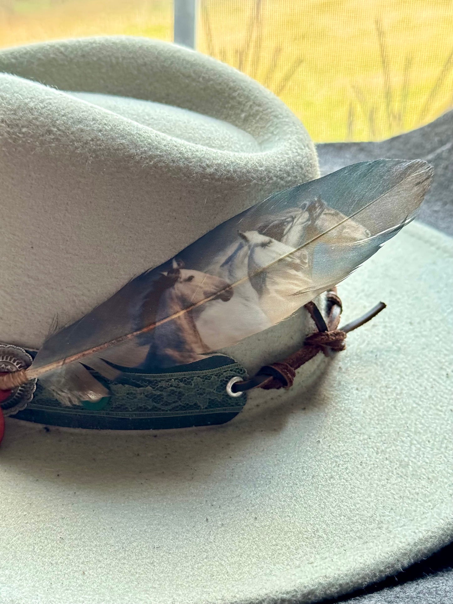 Buckaroo Supply Co. Western hat feather with wild horse artwork