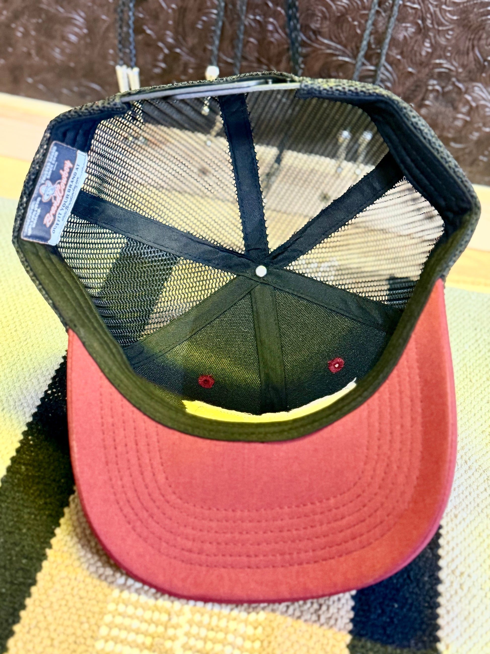 Back view of Atomic Buckaroo Western trucker hat with black mesh and snapback closure