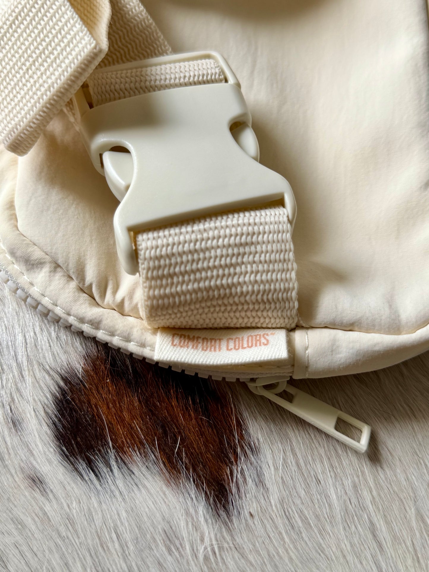Close-up of adjustable strap and buckle on Buckaroo Western Explorer Sling Bag