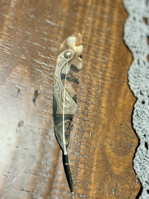 Handcrafted Spur It Up feather accessory for Western hat bands