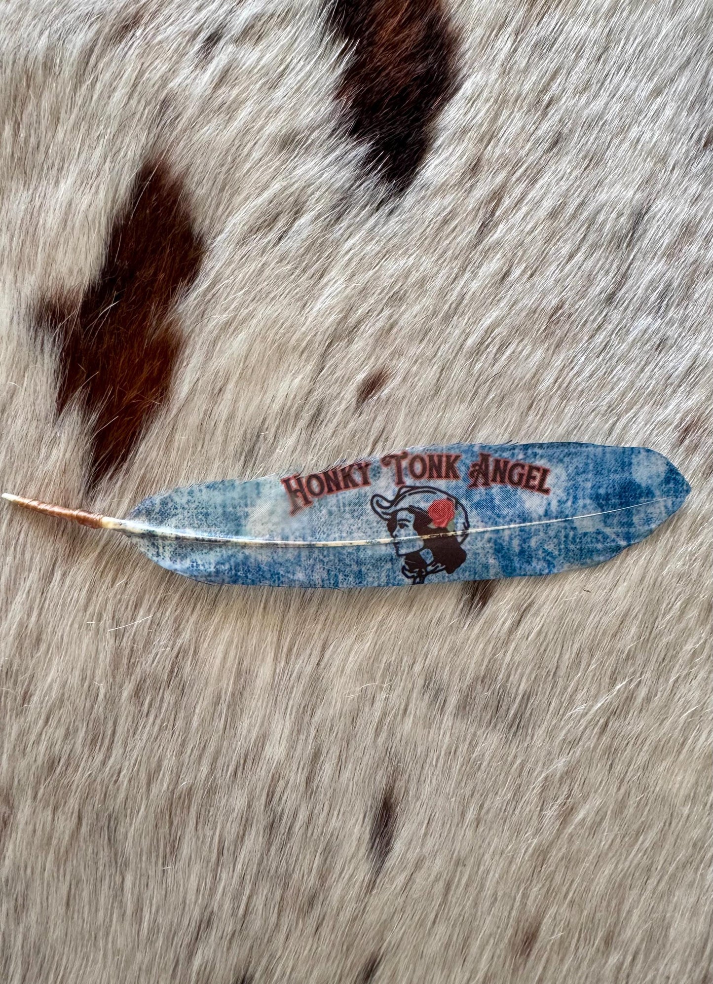 Blue denim-inspired cowboy hat feather with vintage cowgirl design