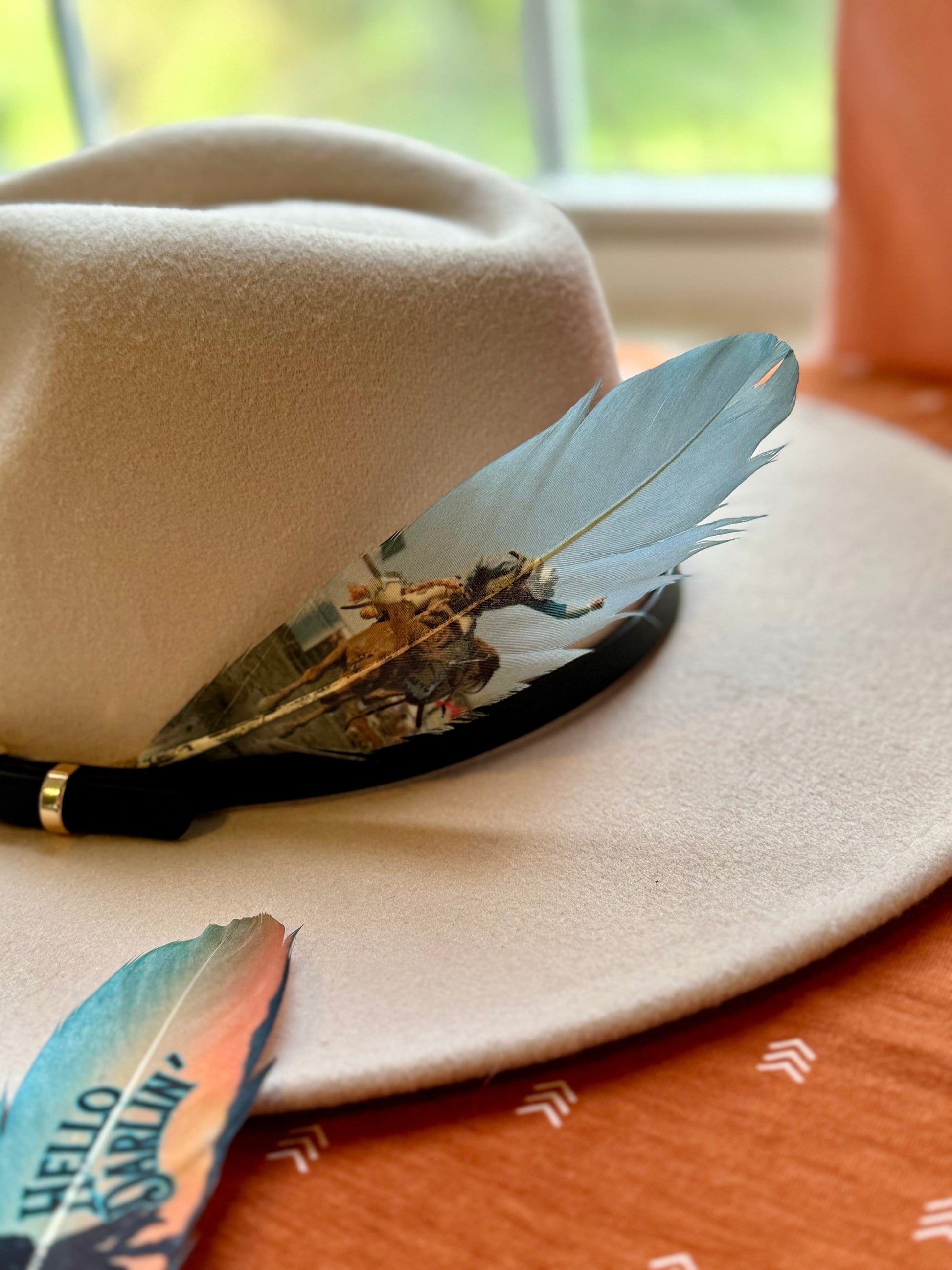Buckaroo Supply Co. blue rodeo-inspired Western hat feather
