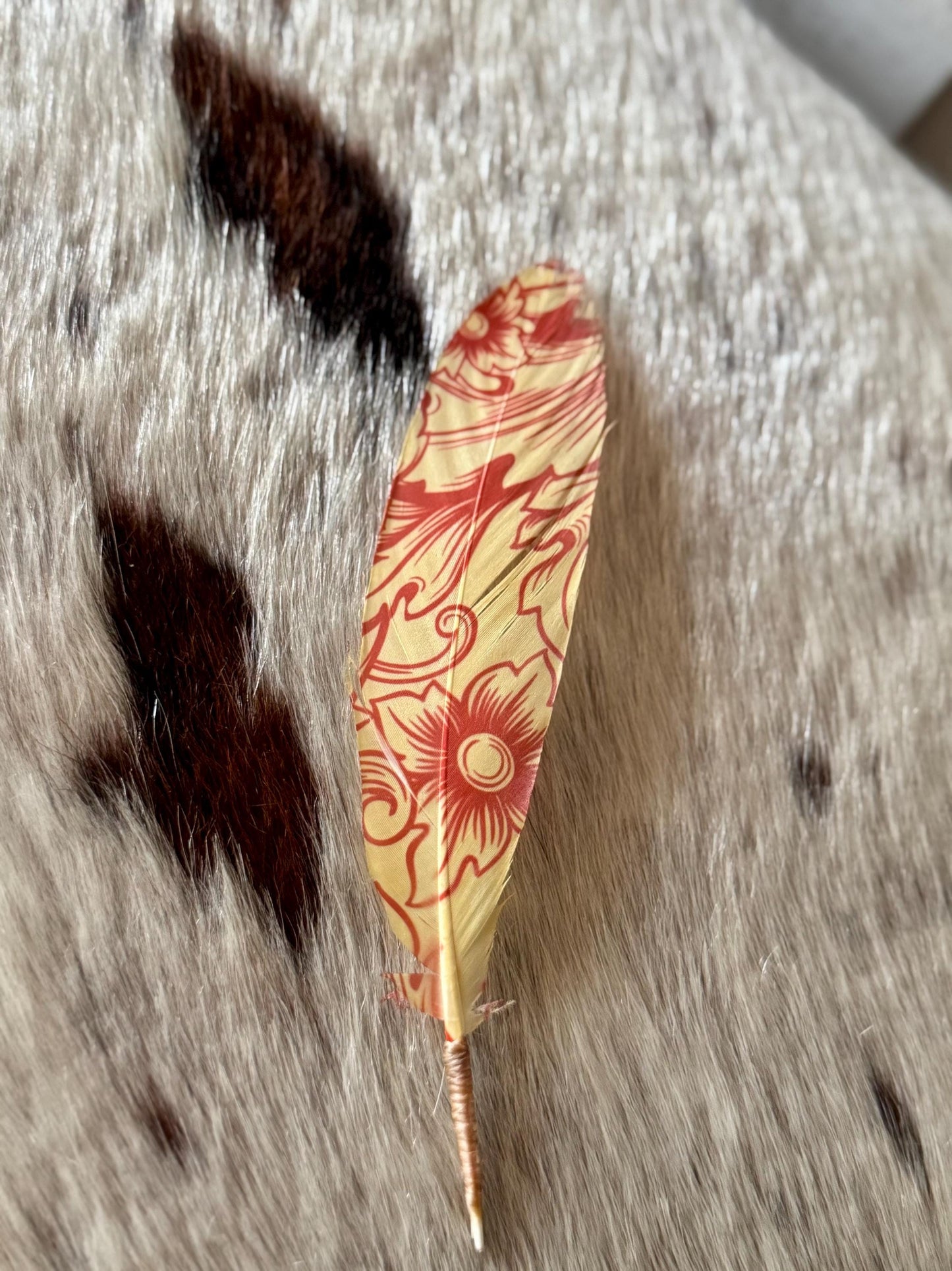 Cream and red floral cowboy hat feather with vintage Western scrollwork