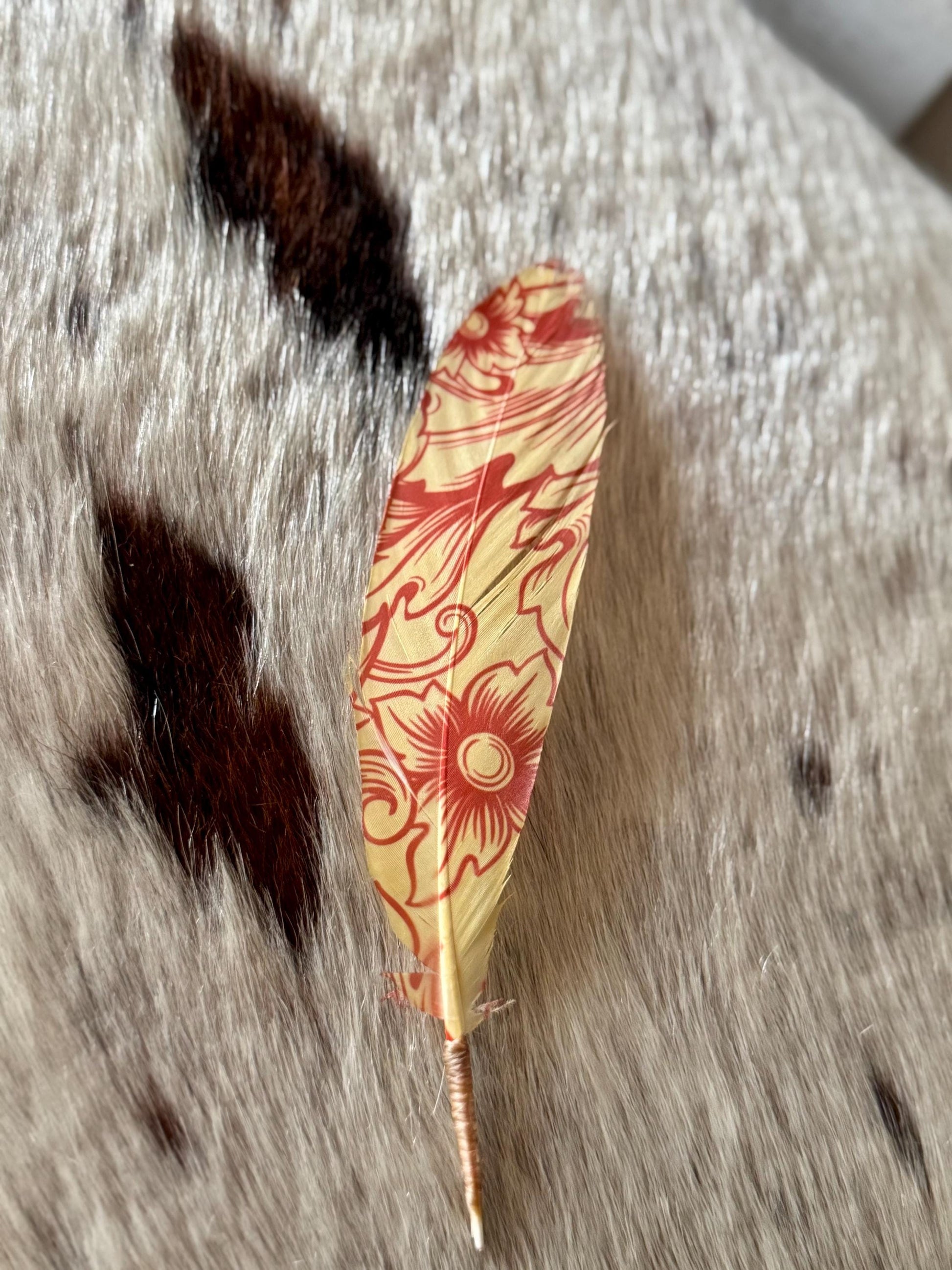 Cream and red floral cowboy hat feather with vintage Western scrollwork