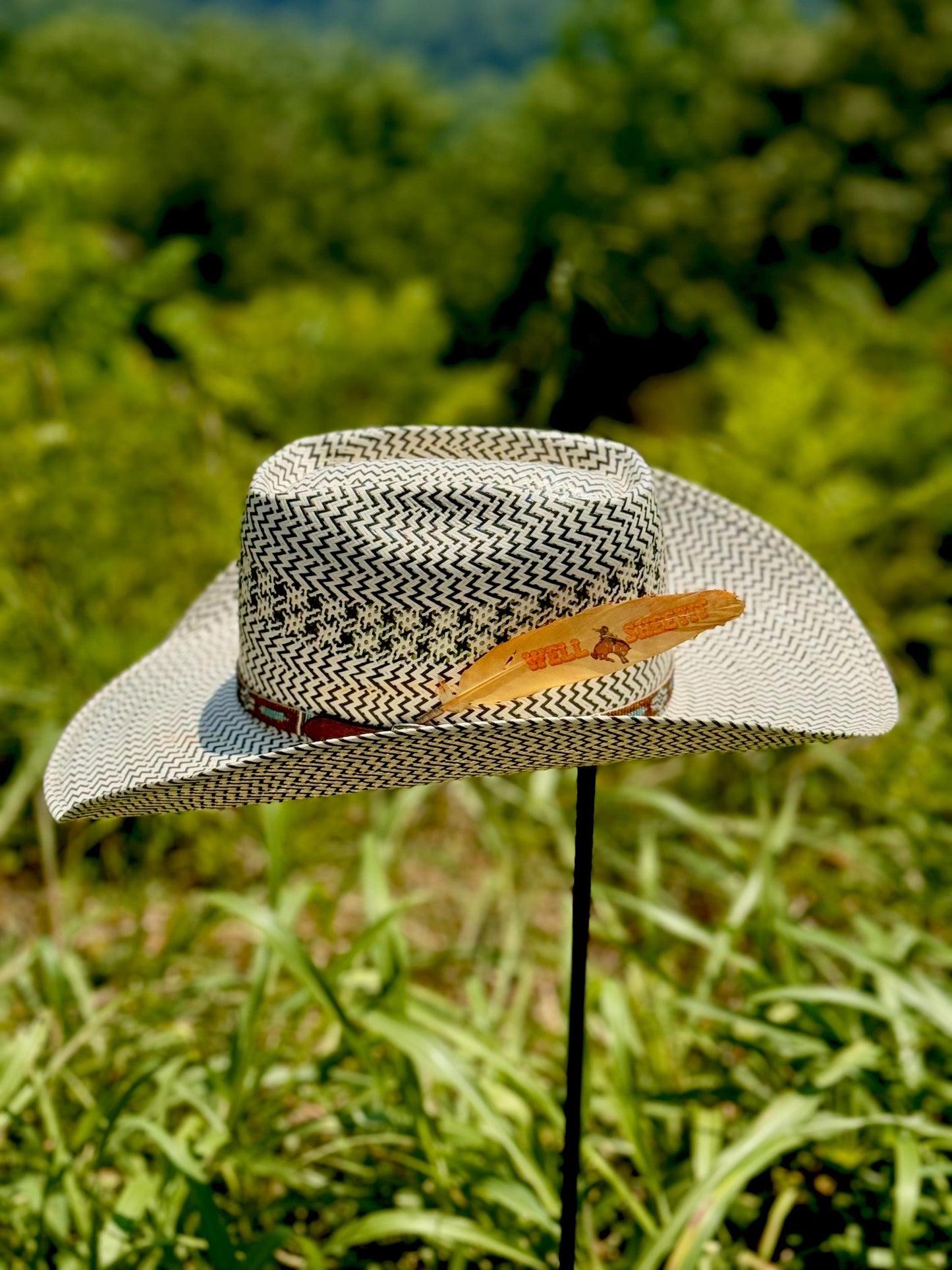 Orange bronc rider cowboy hat feather by Buckaroo Supply Co.