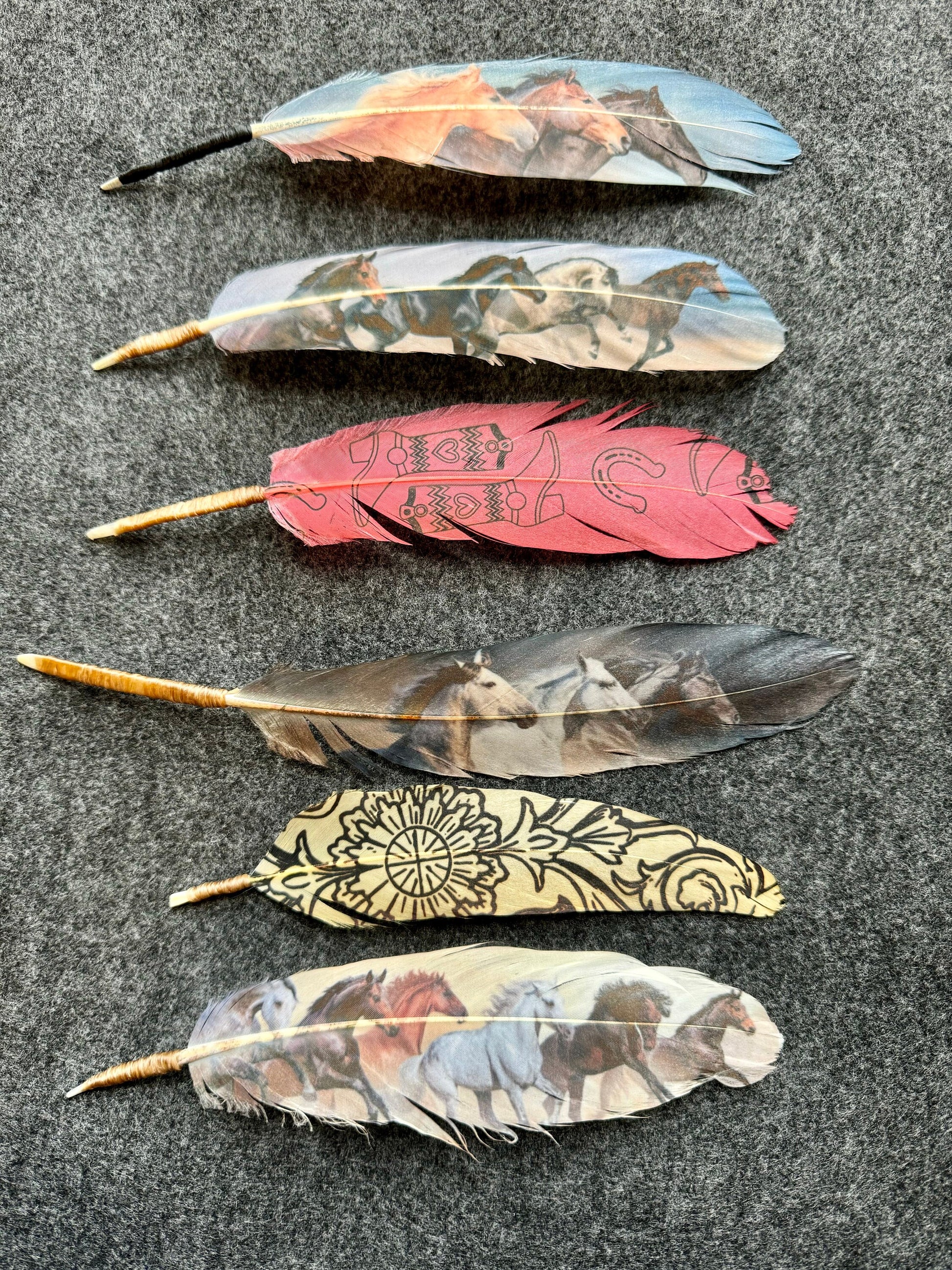 Decorative feathers with patterns on a dark surface