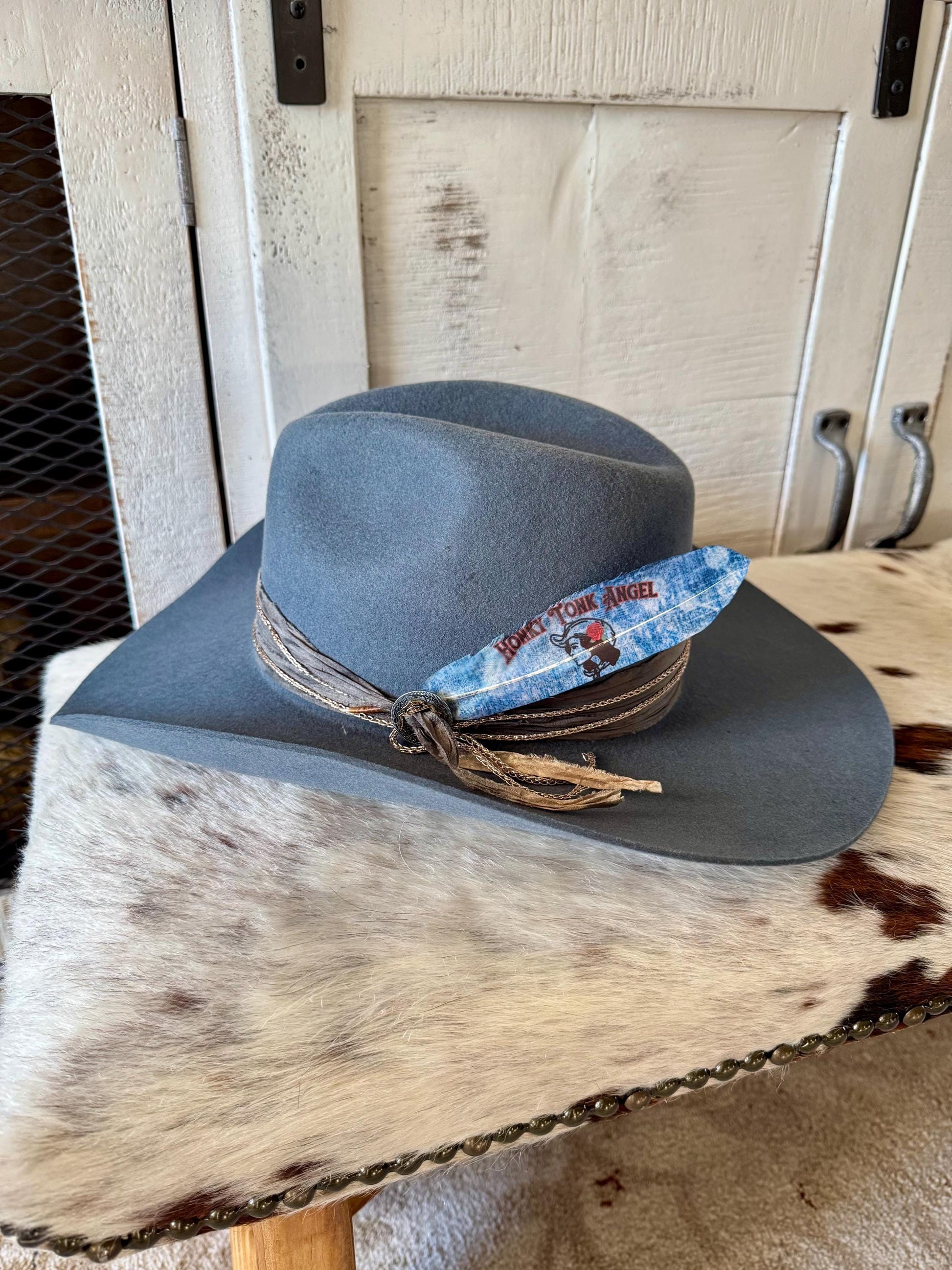 Honky Tonk Angel Western hat feather on a gray felt cowboy hat