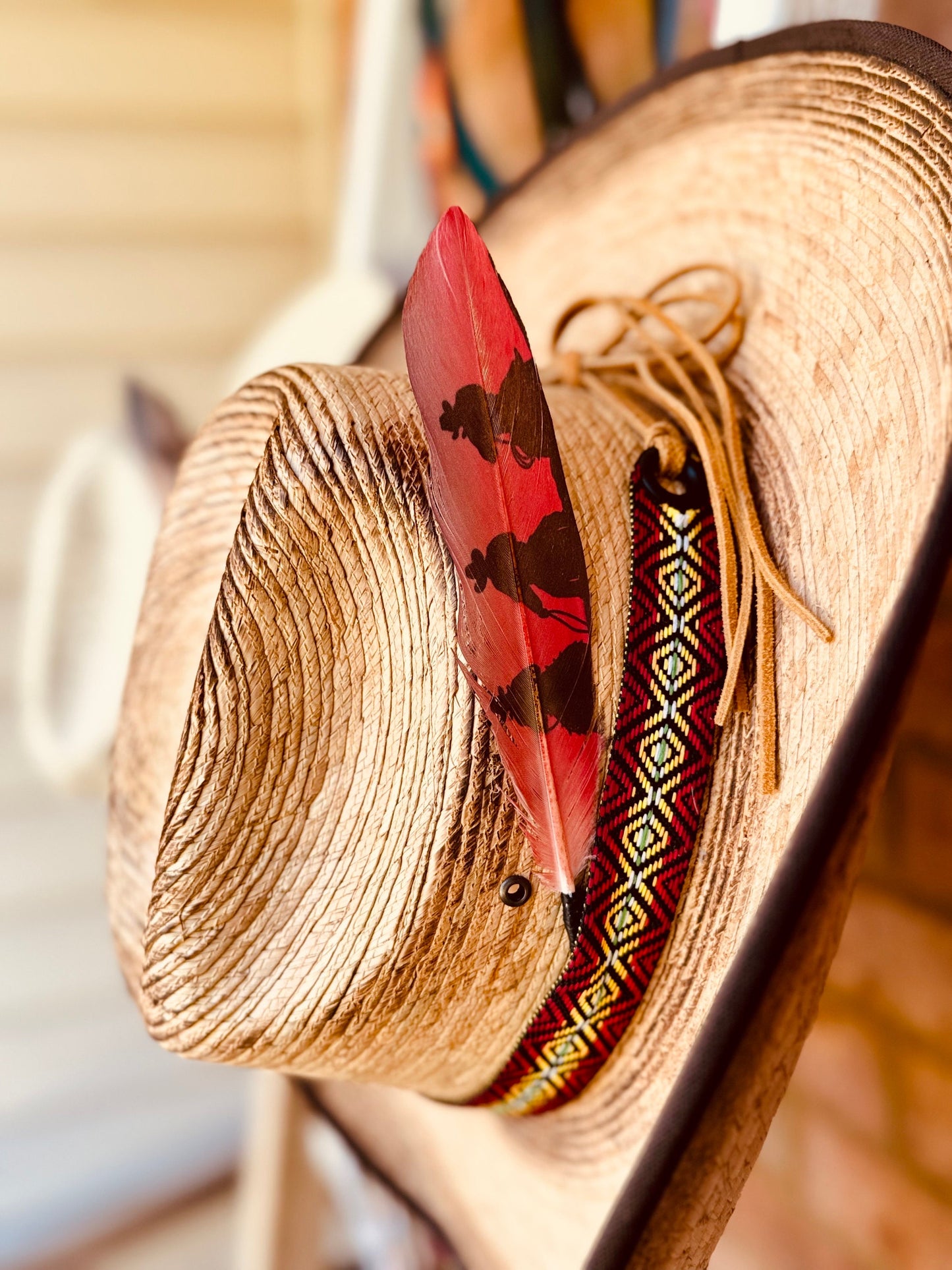 Buckaroo Supply Co. red Western hat feather with sky-rider style