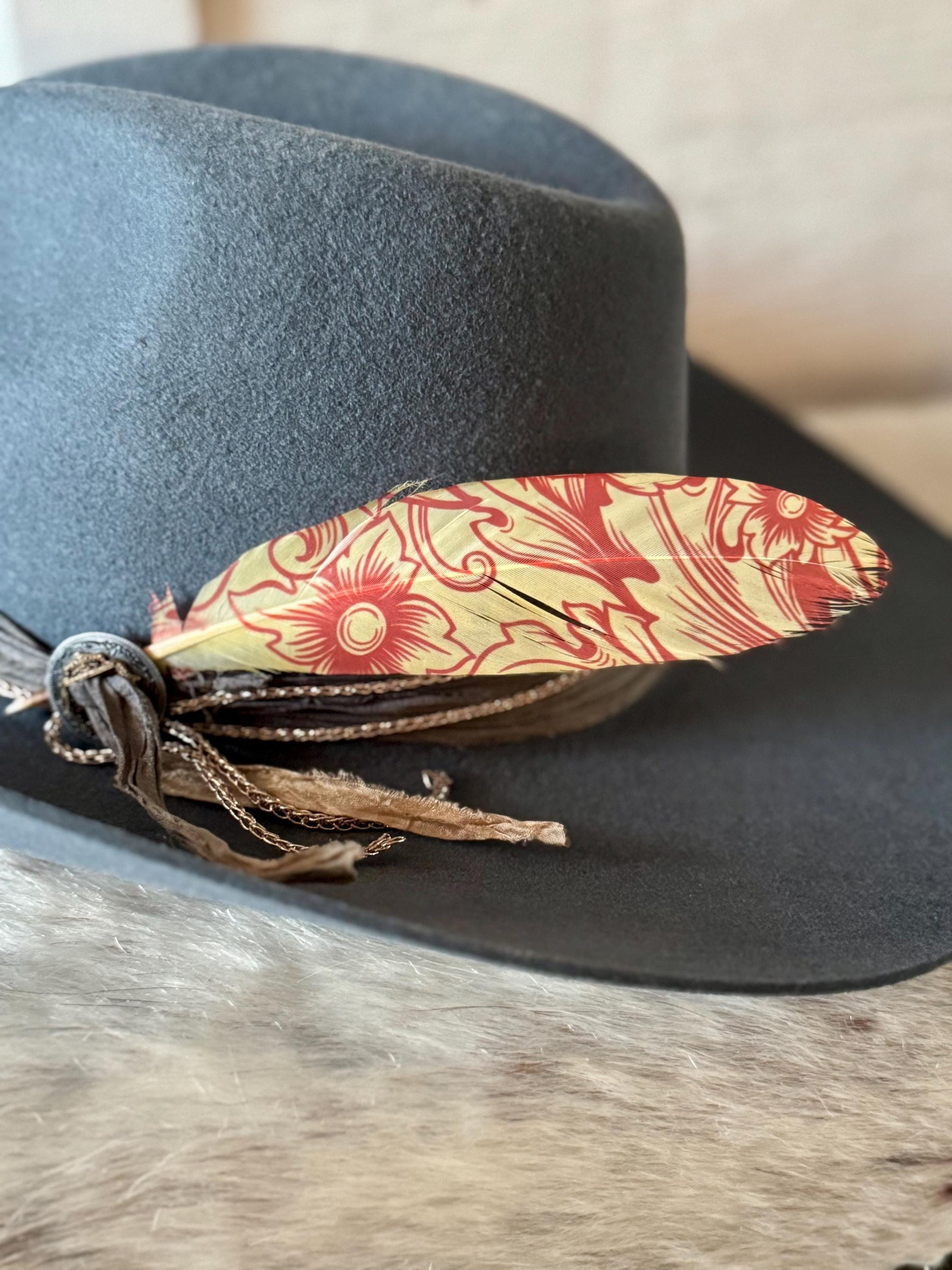 Buckaroo Supply Co. floral Western hat feather in warm red and cream tones