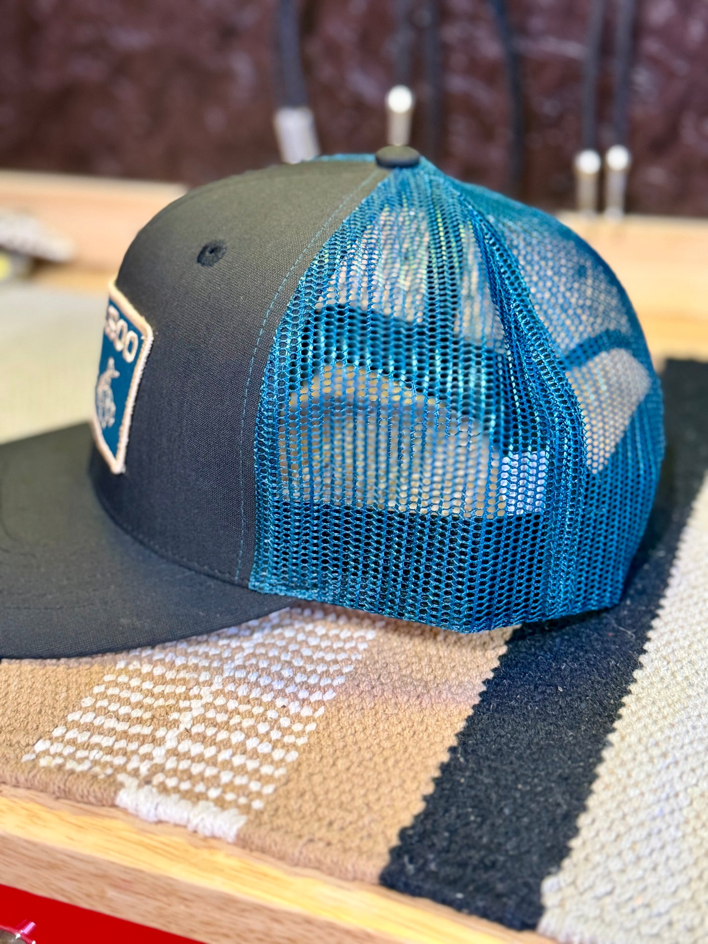 Side view of teal mesh back on Buckaroo Western trucker hat