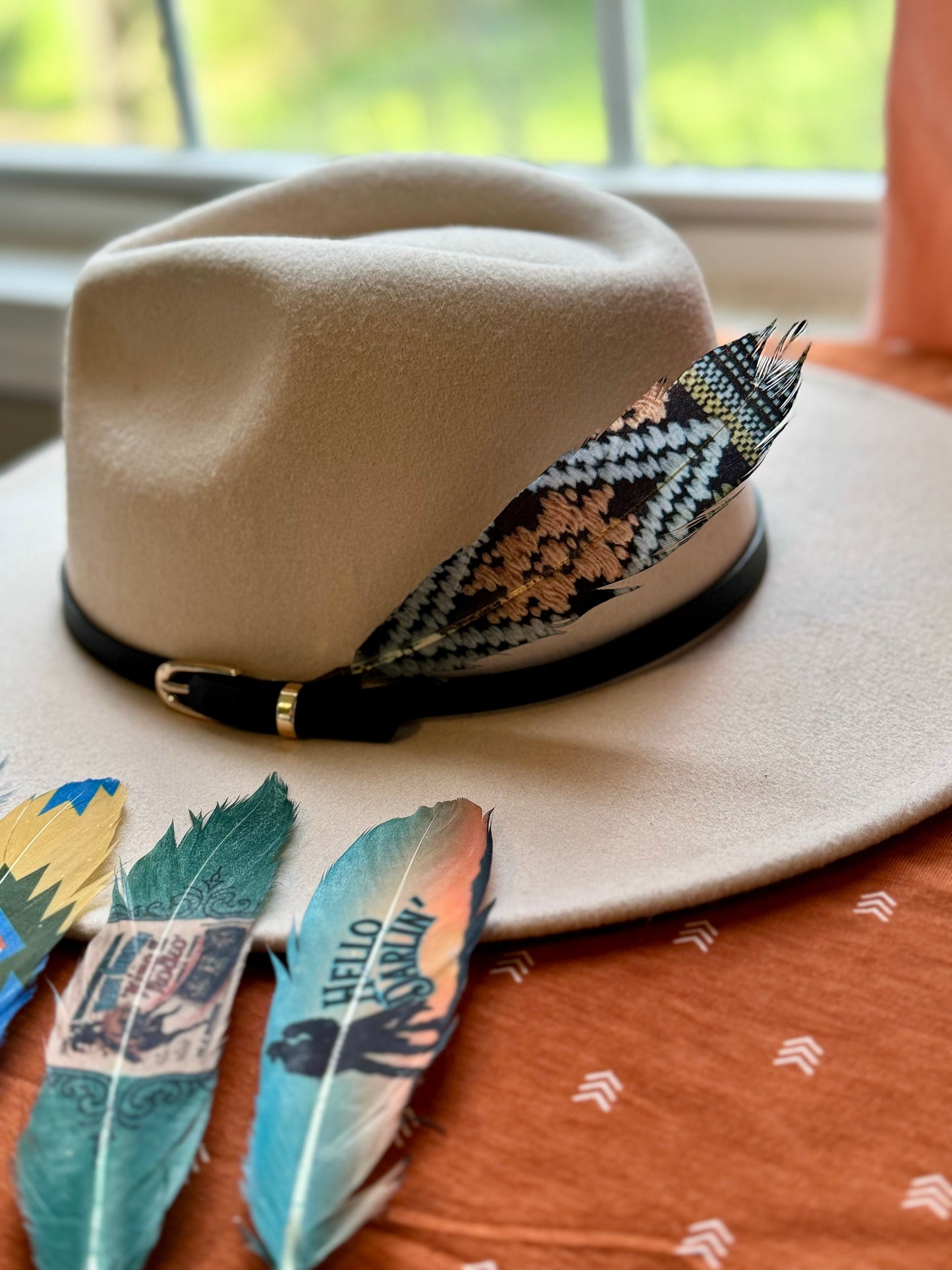 Buckaroo Supply Co. dark Southwestern Western hat feather. Handcrafted Night Weaver feather accessory for Western hat bands.
