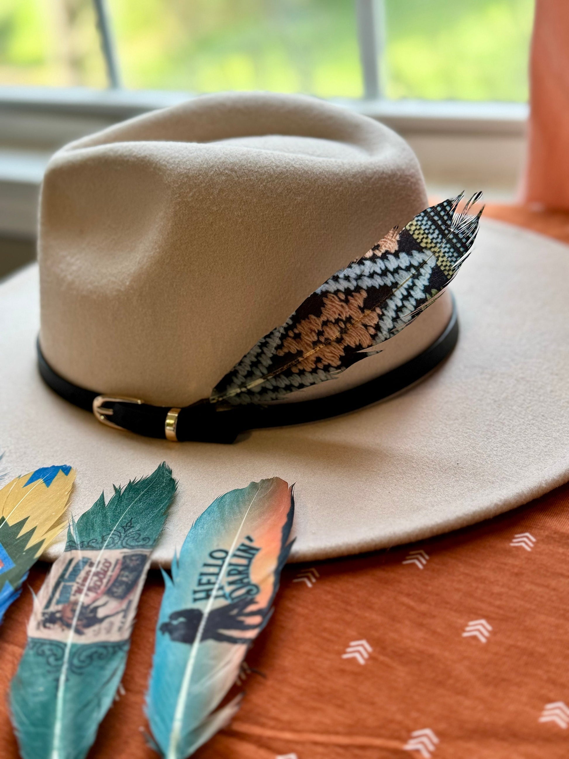 Buckaroo Supply Co. dark Southwestern Western hat feather. Handcrafted Night Weaver feather accessory for Western hat bands.

