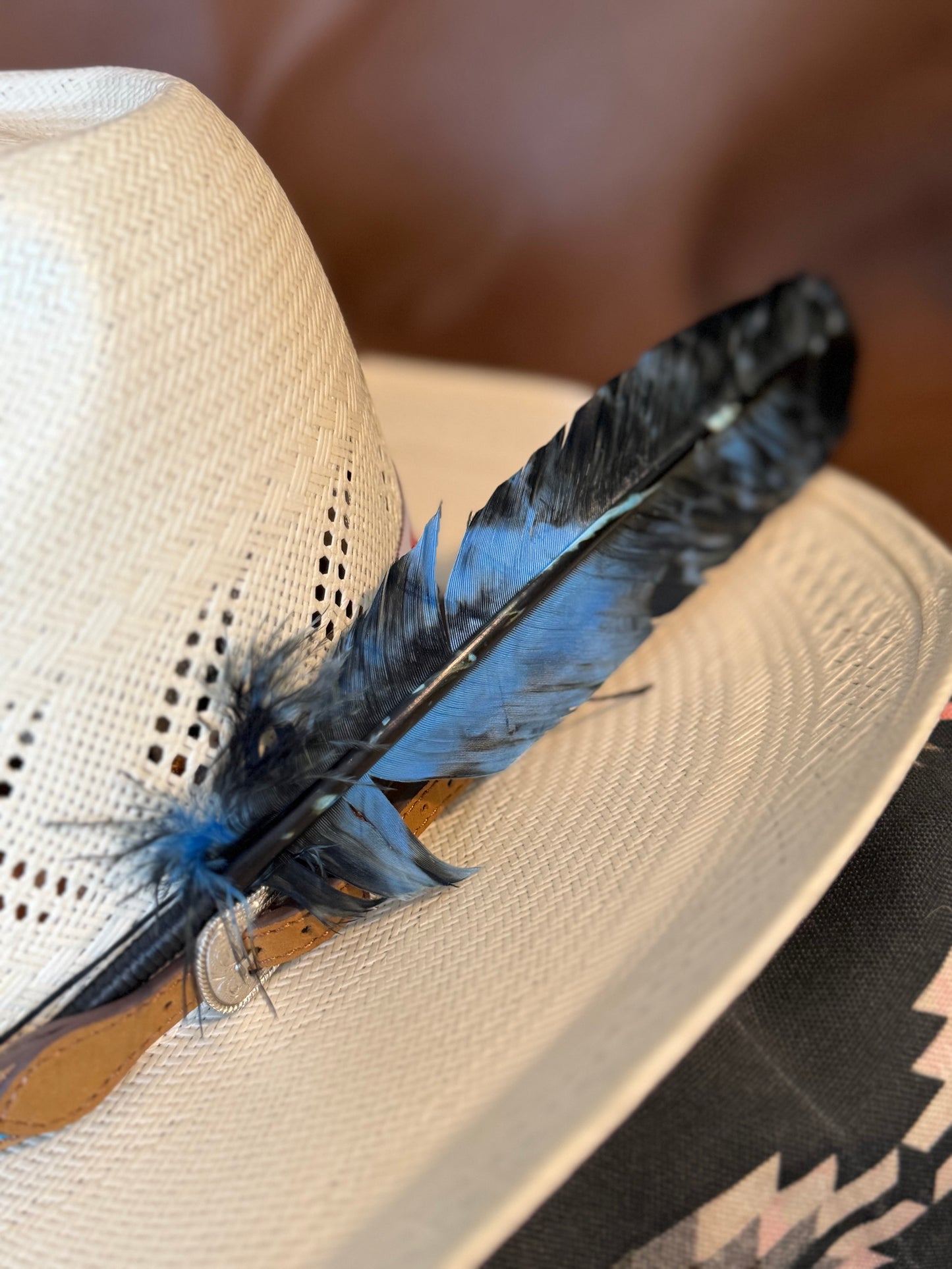 Blue and black marbled Western hat feather by Buckaroo Supply Co.