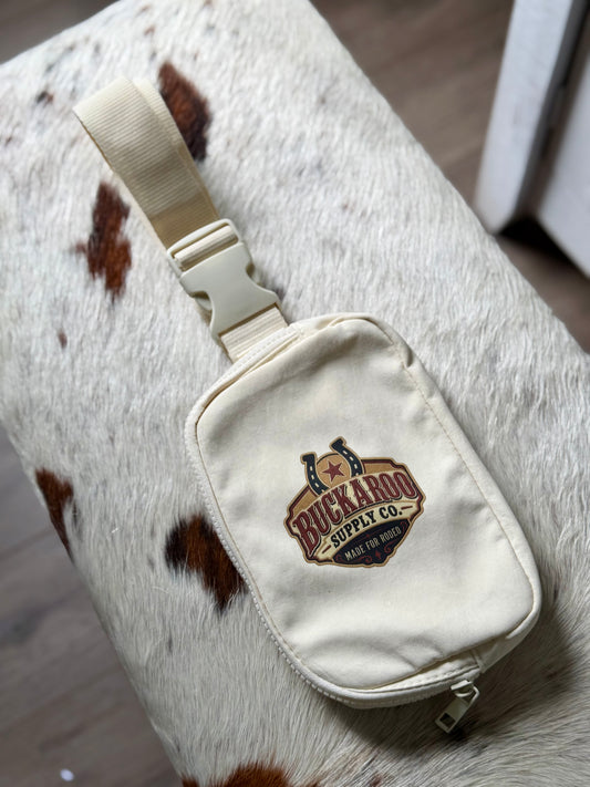 Buckaroo Rodeo Logo Western Explorer Sling Bag on cowhide background