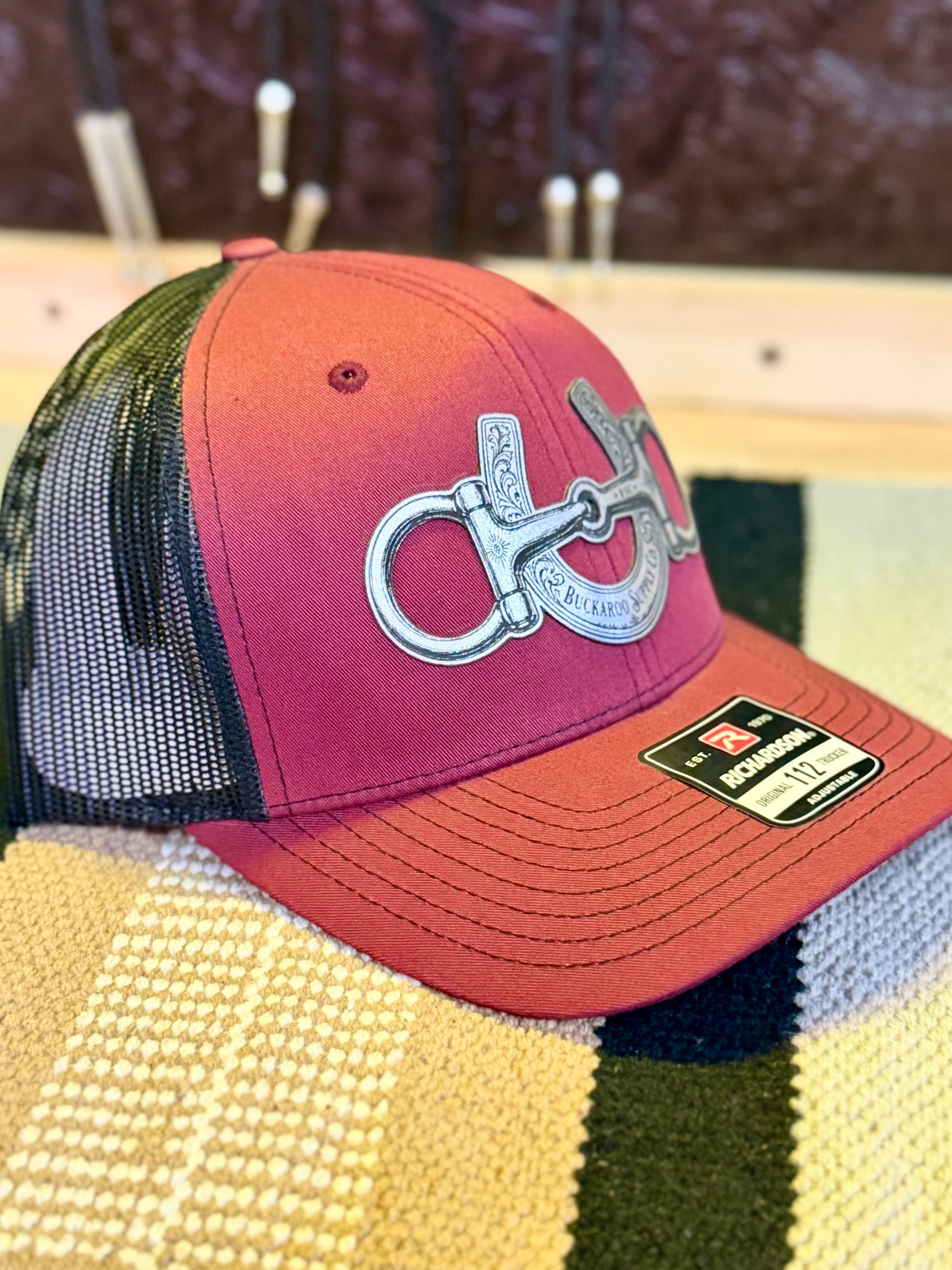 Snaffle Bit and Horseshoe Western trucker hat in cardinal and black