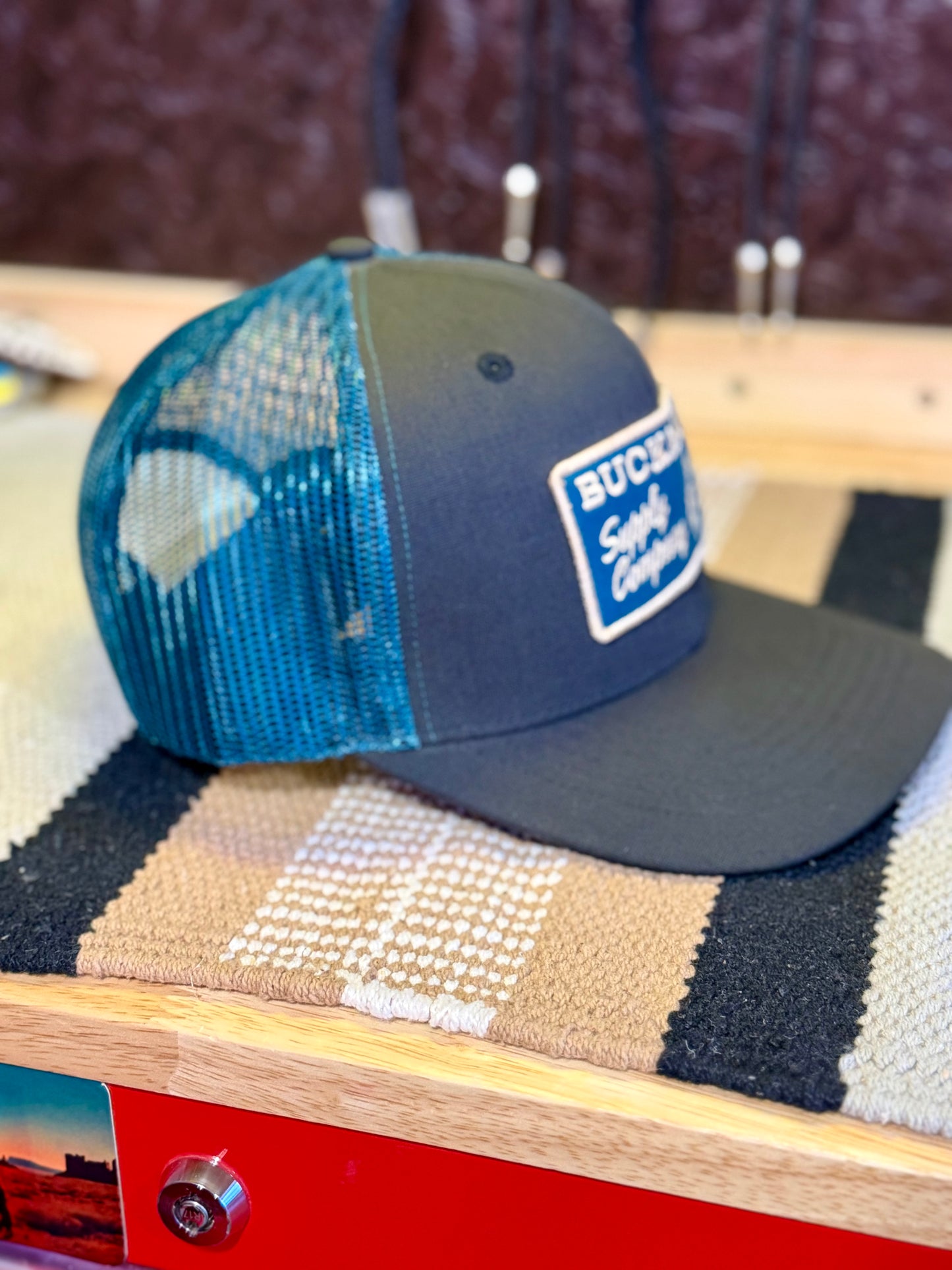 Side view of teal mesh back on Buckaroo Western trucker hat
