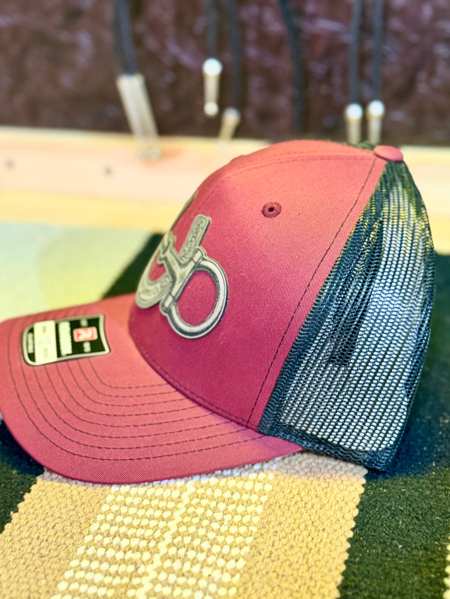 Snaffle Bit and Horseshoe Western trucker hat in cardinal and black