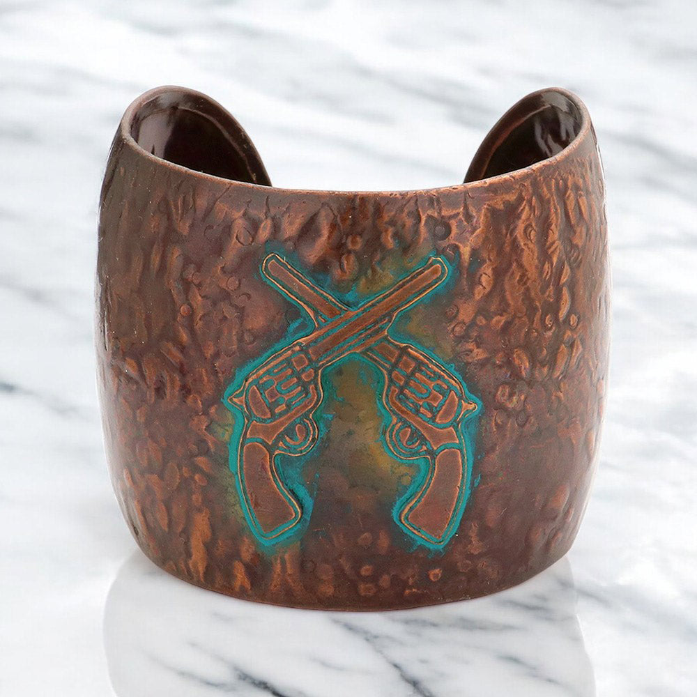 Burnished copper hammered cuff bracelet with turquoise crossed revolvers