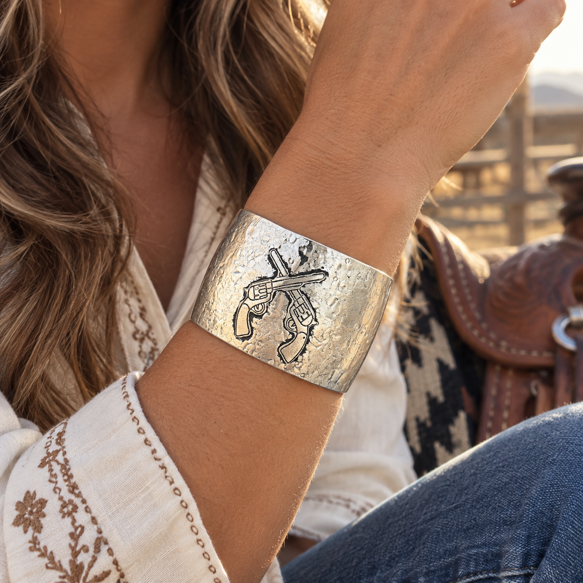 Cowgirl wearing silver crossed revolvers Western cuff bracelet