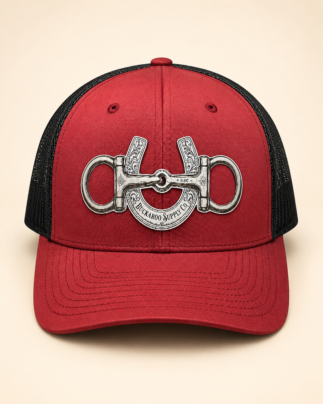 Buckaroo Supply Co. cardinal and black Western trucker hat with snaffle bit and horseshoe design