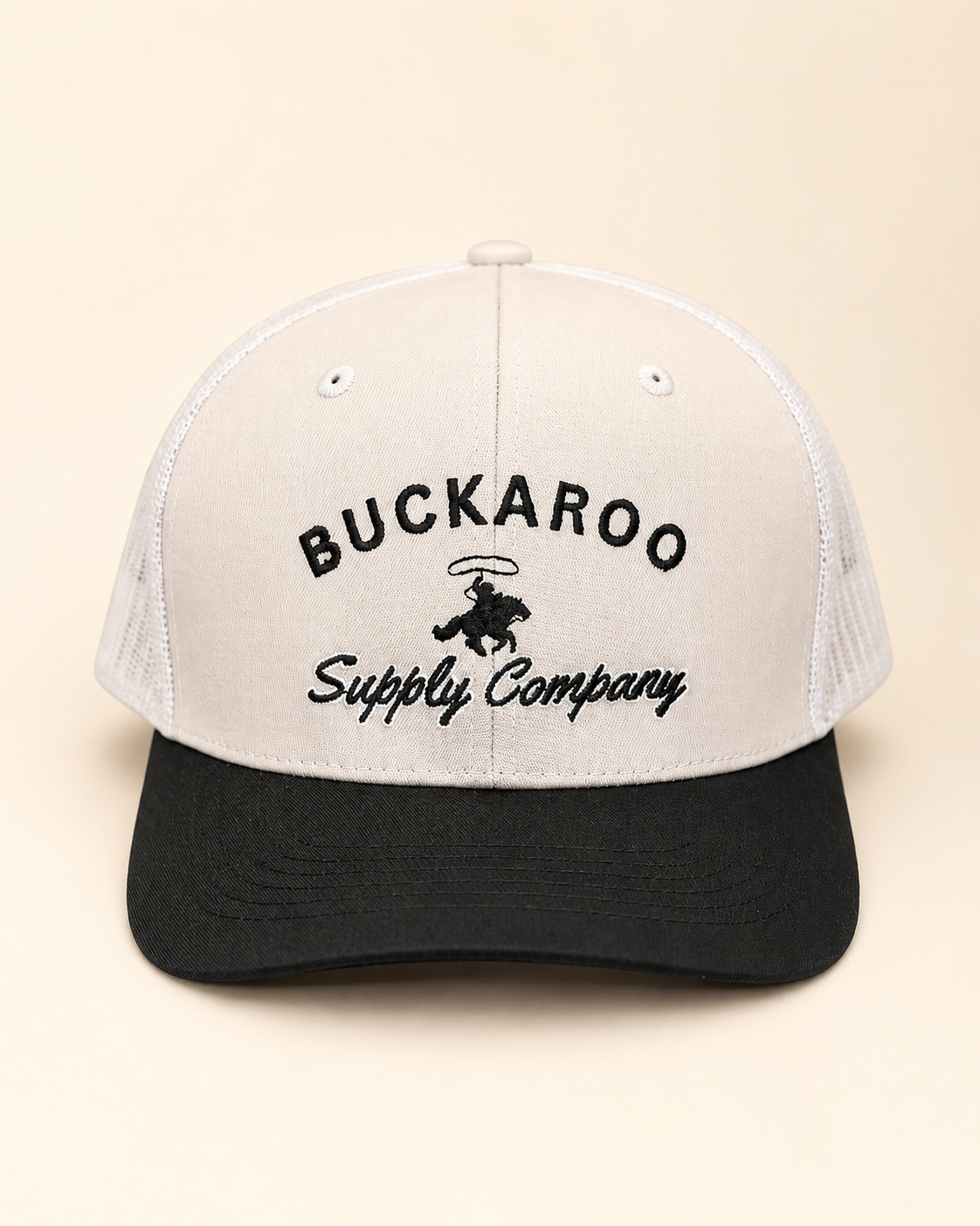 Buckaroo Tan and Black Western trucker hat with embroidered bronc rider design
