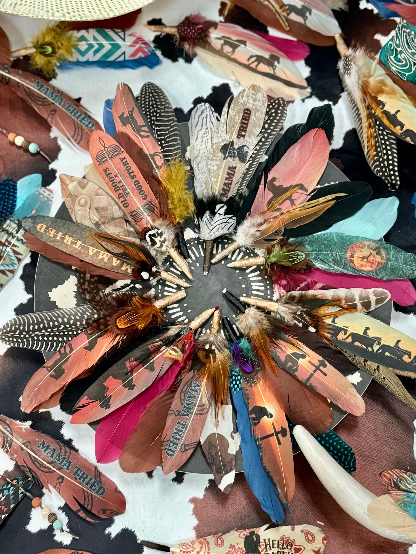 Collection of colorful feathers with various patterns and designs.