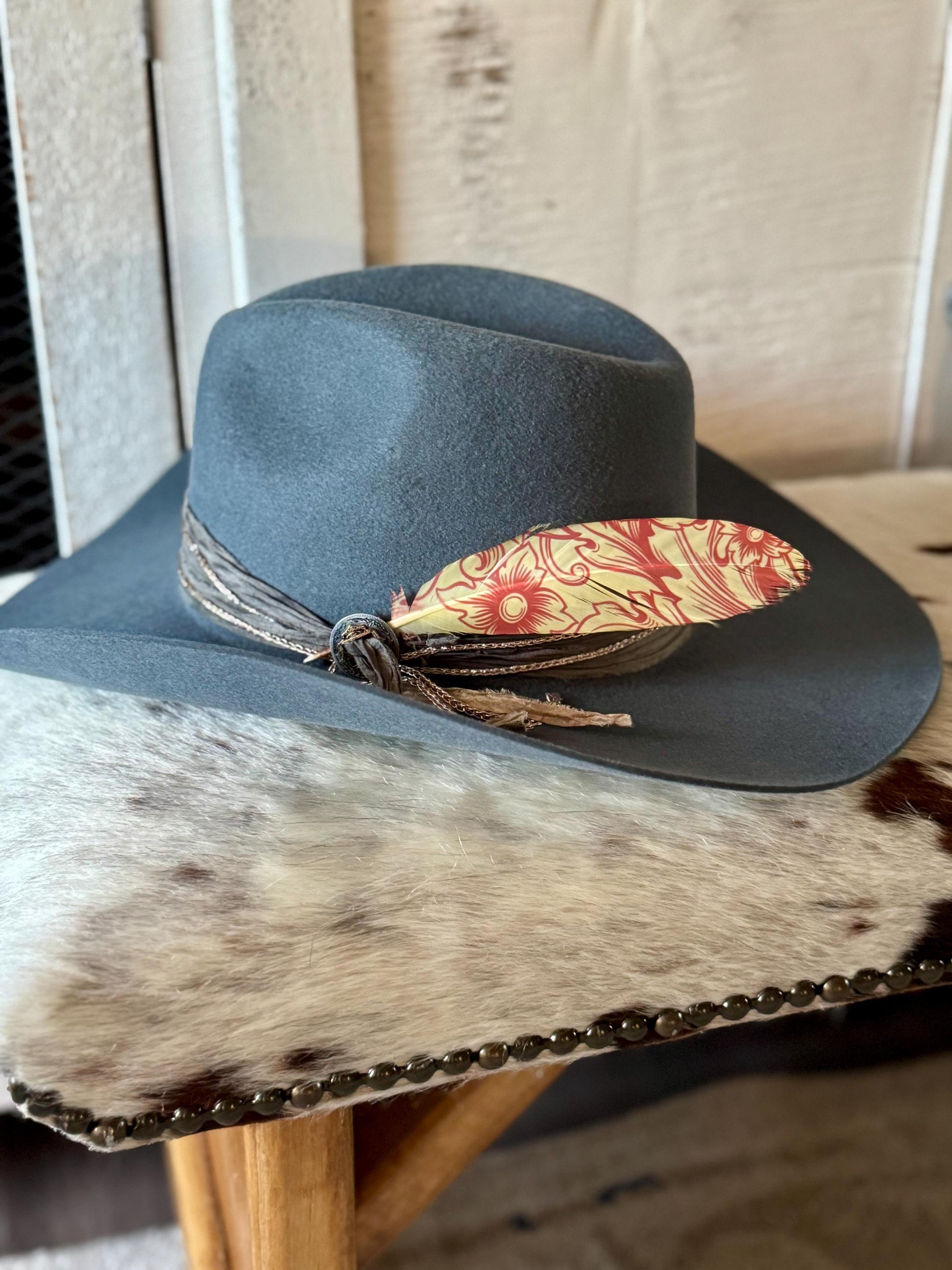 Western Floral Western hat feather on a gray felt cowboy hat