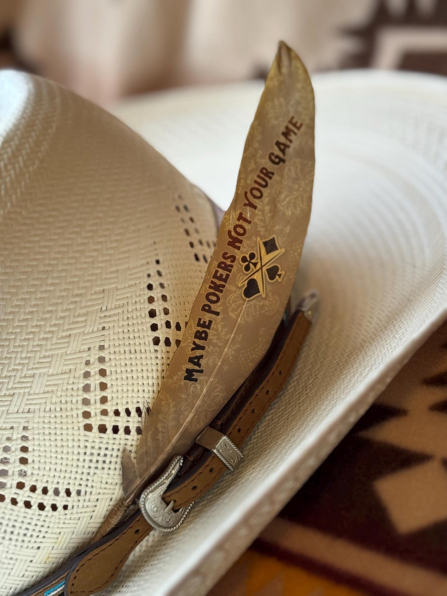 Sepia Old West cowboy hat feather with playing card detail