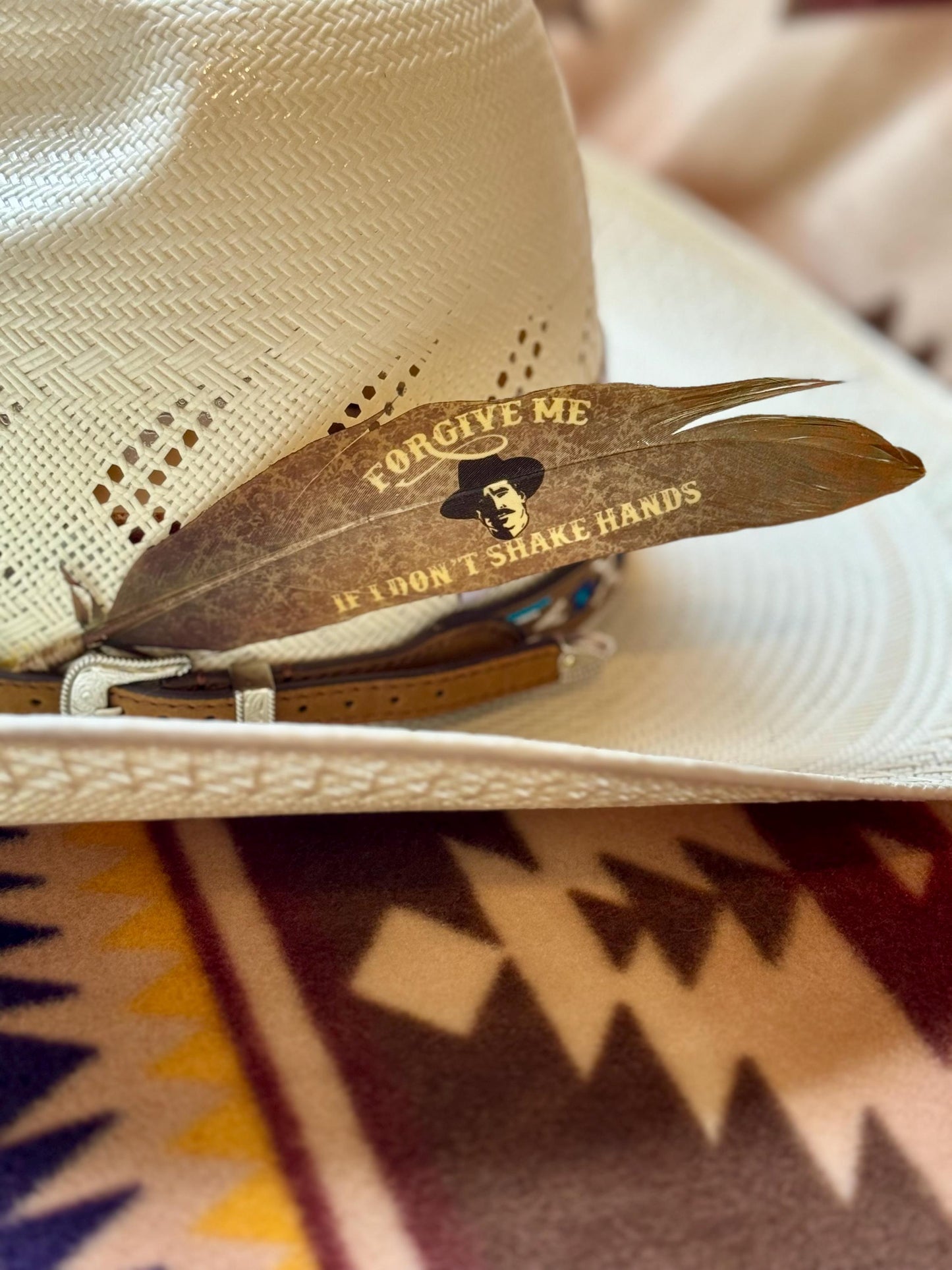 Handcrafted Forgive Me feather accessory for Western hat bands