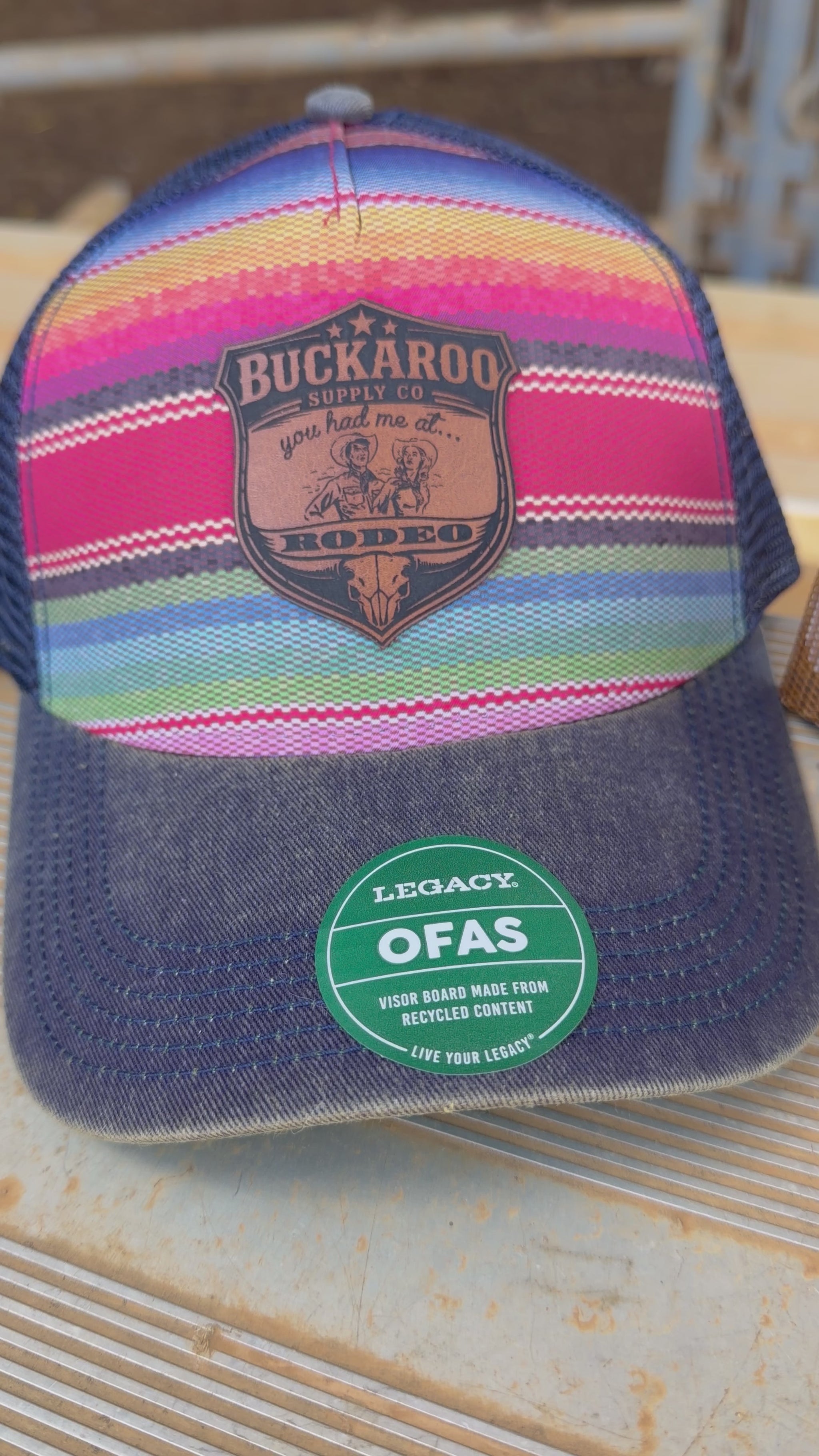 Colorful serape striped trucker hat with a Buckaroo Supply Co logo.